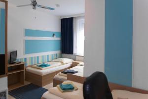 Säng eller sängar i ett rum på Pension Central Nuernberg-Fuerth
