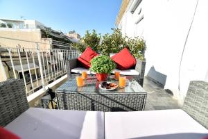 A balcony or terrace at Central Athens Studios