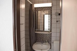 Koupelna v ubytování Pension Central Nuernberg-Fuerth + 37 fotografií