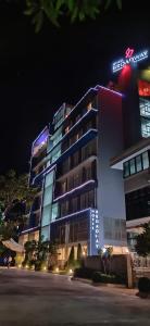 a building with a sign on it at night at Hotel Broadway Yangon in Yangon