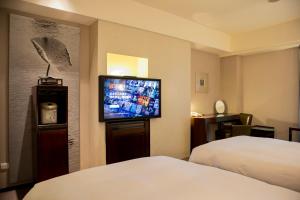 Voodi või voodid majutusasutuse Les Suites Taipei - Da An toas