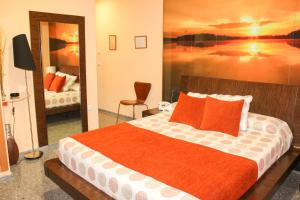Postel nebo postele na pokoji v ubytování Hospedium Hotel Don Jose