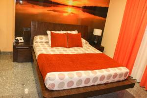 Postel nebo postele na pokoji v ubytování Hospedium Hotel Don Jose