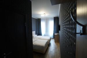 Säng eller sängar i ett rum på HOTEL CITY M