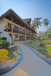 a resort with a pathway leading to a building at Pongwe Bay Resort in Pongwe