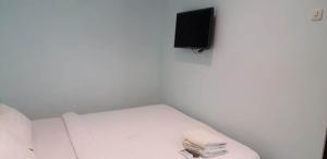 Postel nebo postele na pokoji v ubytování Shinta Guesthouse