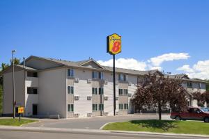 a building with a traffic light in front of it at Super 8 by Wyndham Pocatello in Pocatello