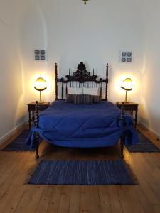 Uma cama ou camas num quarto em Casa de Virgilio - MOIRA
