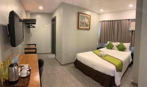 Postel nebo postele na pokoji v ubytování Cebu R Hotel Capitol + 37 fotografií