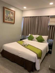 Voodi või voodid majutusasutuse Cebu R Hotel Capitol toas