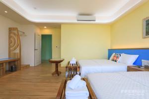 Postel nebo postele na pokoji v ubytování Pon Pon Wu Homestay