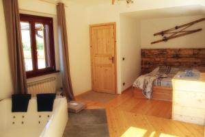 A bed or beds in a room at Al bosco incantato