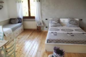 A bed or beds in a room at Al bosco incantato