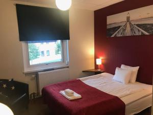 Letto o letti in una camera di Port Hotel