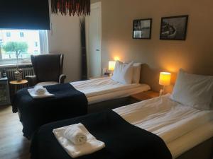 Letto o letti in una camera di Port Hotel