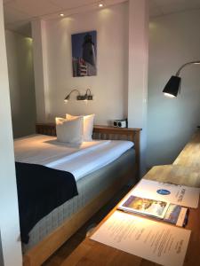 Letto o letti in una camera di Port Hotel