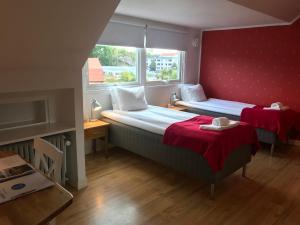 Letto o letti in una camera di Port Hotel
