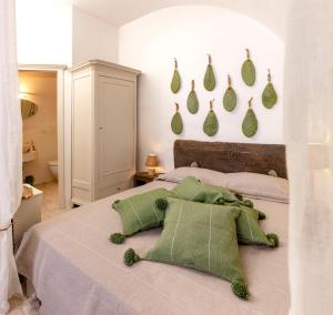 Postel nebo postele na pokoji v ubytování Alesia luxury suite Ostuni