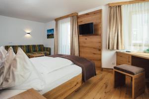 Postel nebo postele na pokoji v ubytování Hotel Post