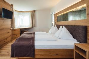 Postel nebo postele na pokoji v ubytování Hotel Post
