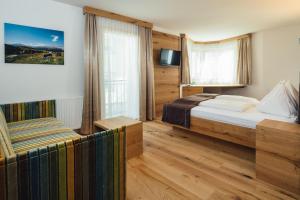 Postel nebo postele na pokoji v ubytování Hotel Post