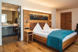 Postel nebo postele na pokoji v ubytování Hotel Post