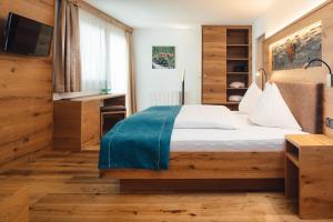 Postel nebo postele na pokoji v ubytování Hotel Post