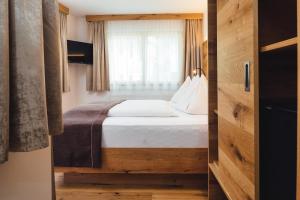 Postel nebo postele na pokoji v ubytování Hotel Post