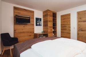 Postel nebo postele na pokoji v ubytování Hotel Post