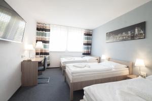Postel nebo postele na pokoji v ubytování Interhotel Bohemia