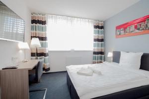 Postel nebo postele na pokoji v ubytování Interhotel Bohemia