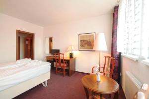 Postel nebo postele na pokoji v ubytování Interhotel Bohemia