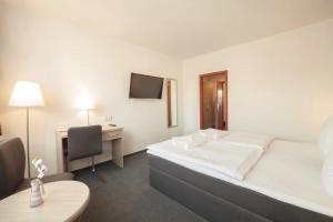 Postel nebo postele na pokoji v ubytování Interhotel Bohemia