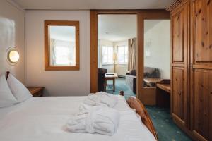Postel nebo postele na pokoji v ubytování Hotel Post