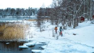 two people cross country skiing in the snow at Lapland Hotels Bulevardi in Helsinki