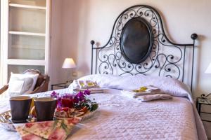 a bed with a plate of food on it at Agriturismo La Mignola in Quercianella