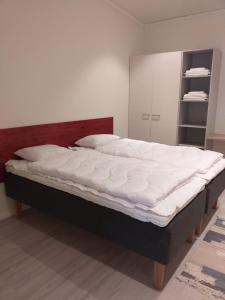 Кровать или кровати в номере Rukariutta Apartments