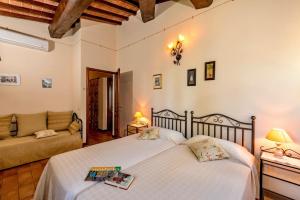 Postel nebo postele na pokoji v ubytování Agriturismo CaseGraziani + 37 fotografií