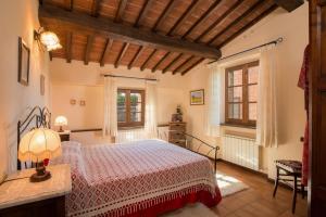 Postel nebo postele na pokoji v ubytování Agriturismo CaseGraziani