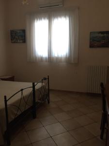 Postel nebo postele na pokoji v ubytování Agriturismo da Regina
