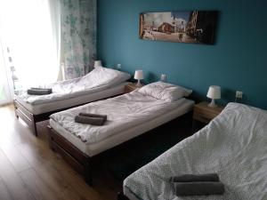 Łóżko lub łóżka w pokoju w obiekcie Tropikalna Odnowa
