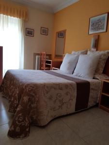 Łóżko lub łóżka w pokoju w obiekcie Hotel Fray Juán Gil