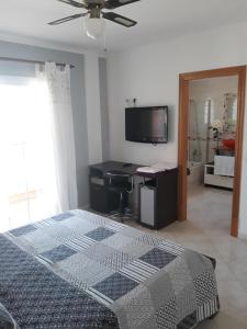 A television and/or entertainment centre at Villa Las Bahías