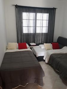 A bed or beds in a room at Villa Las Bahías
