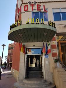 a hotel sign on the front of a building at Hotel Fray Juán Gil in Arévalo