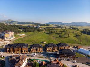 an aerial view of a resort with mountains in the background at Hill Spa in Zlatibor