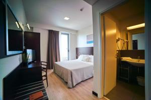 Postel nebo postele na pokoji v ubytování Alisei Palace Hotel