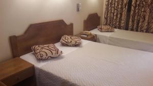 מיטה או מיטות בחדר ב-Hotel Alicante