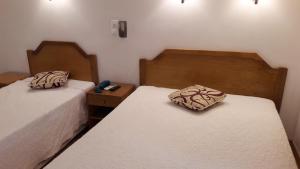Uma cama ou camas num quarto em Hotel Alicante