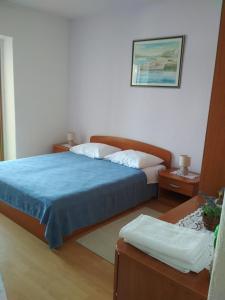 Postel nebo postele na pokoji v ubytování Apartmani Carević